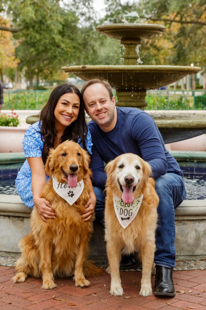 engaged couple with dogs in portrait by Steven Miller Photography
