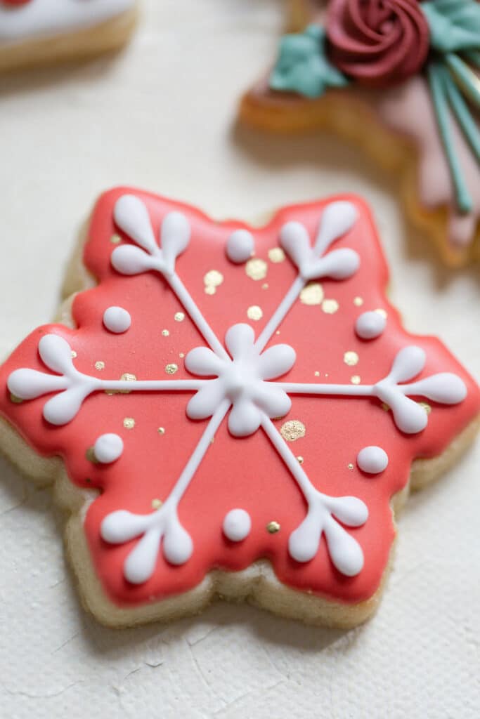 Christmas in July SS 122 1 - Christmas Themed Wedding Inspiration - Inspiration Shoot a red and white snowflake cookies