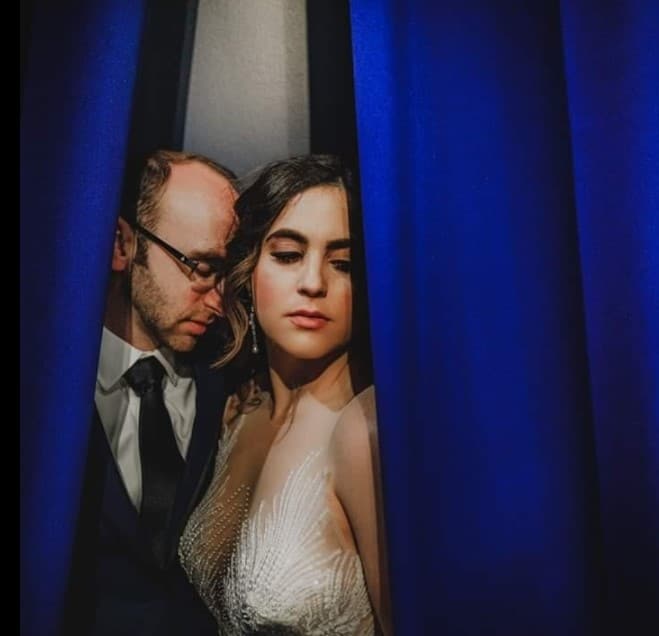 Bride and Groom with blue curtain