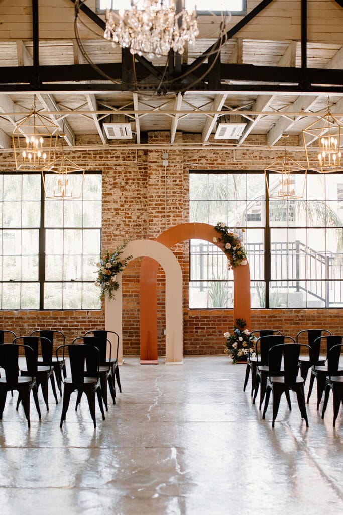Summer Urban Loft Wedding Inspiration Grace Jicha Venue At The Block Wedding Installs 8 websize low - Urban Loft Wedding Inspiration - Styled Shoot the two large pink arches at the end of the aisle at venue at the block