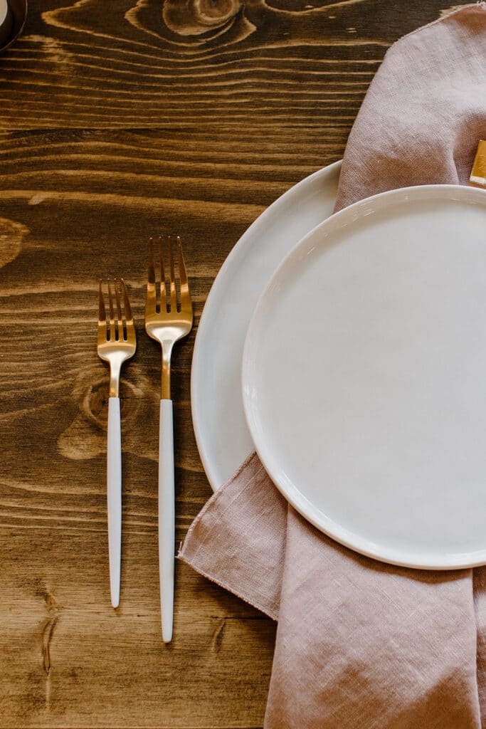 Summer Urban Loft Wedding Inspiration Grace Jicha Venue At The Block Wedding Tablescape 18 websize low - Urban Loft Wedding Inspiration - Styled Shoot the gold forks next to the plates and pink napkin on the reception table