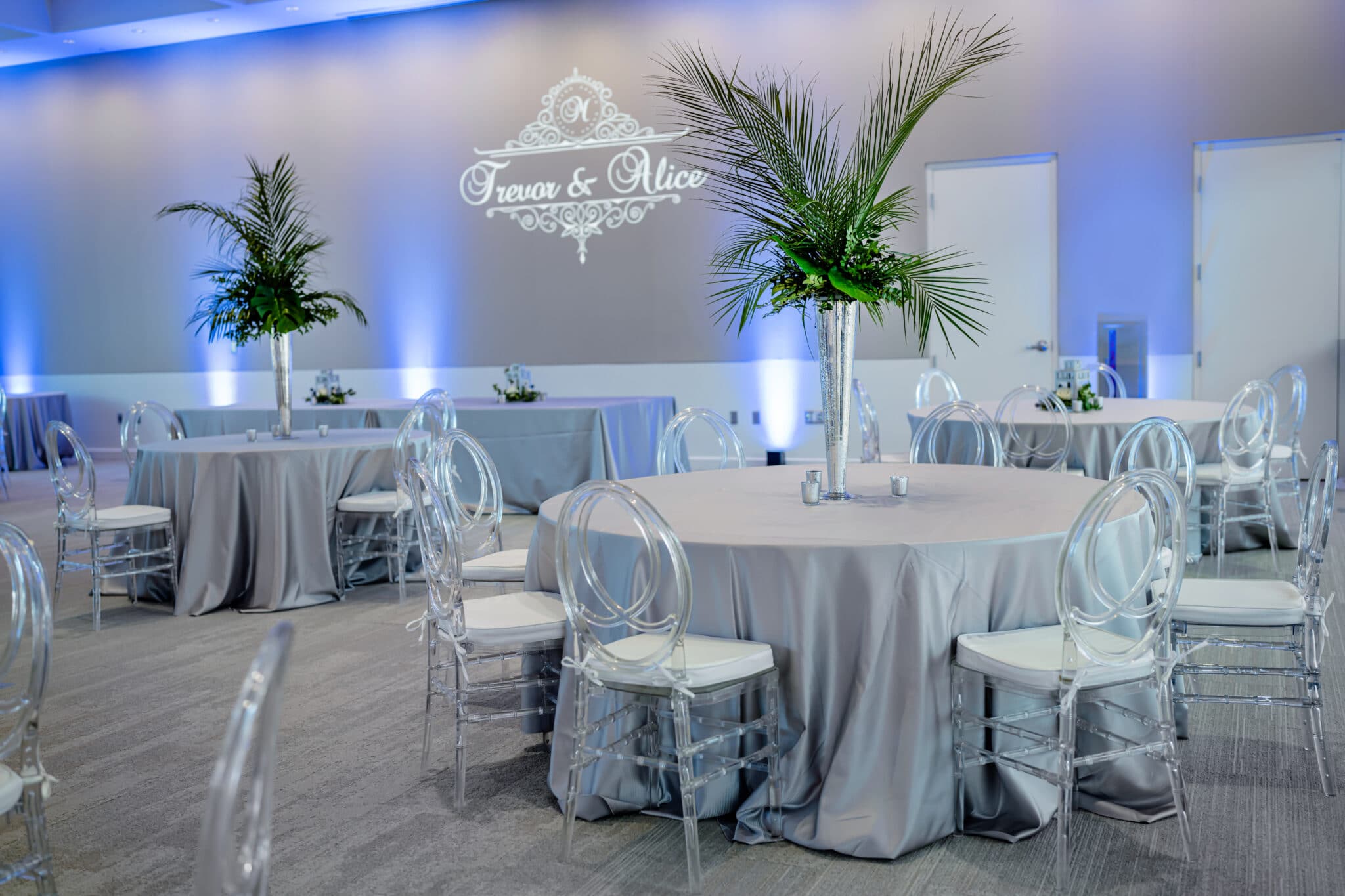 reception tables in white and clear chairs