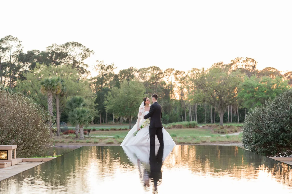 Newlywed couple posing outdoors at Four Seasons Resort Orlando during their Central Florida wedding.