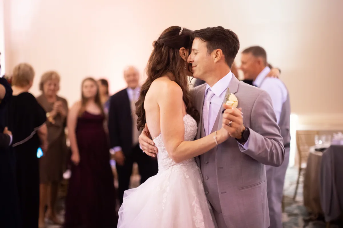 Newlywed couple dancing together during their wedding reception at Waldorf Astoria Orlando.