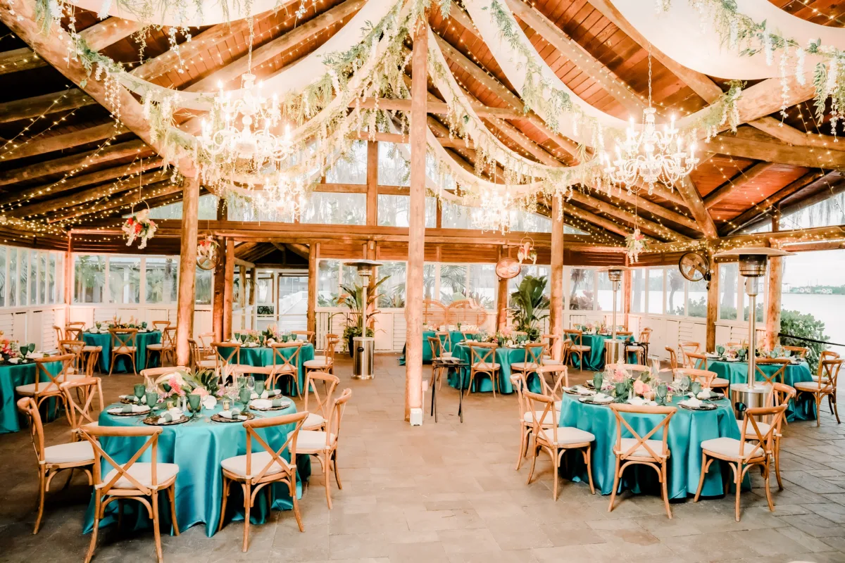 Paradise Cove Orlando wedding reception space decorated with vibrant tropical florals and colorful décor.