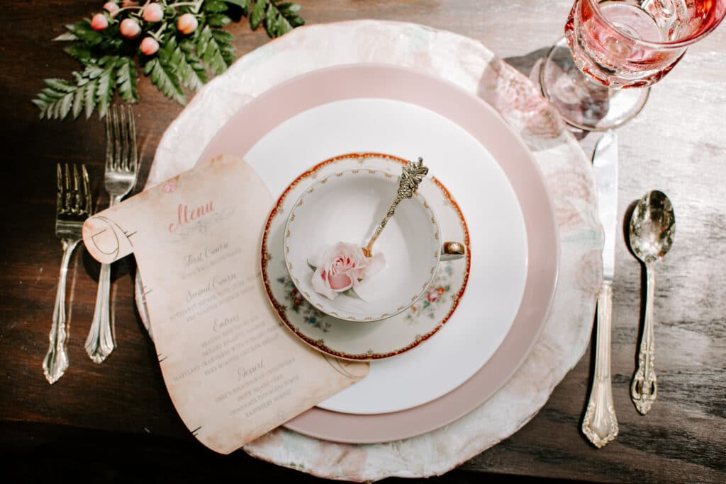 pink and white table setting with scroll menu by Shimmering Ceremony