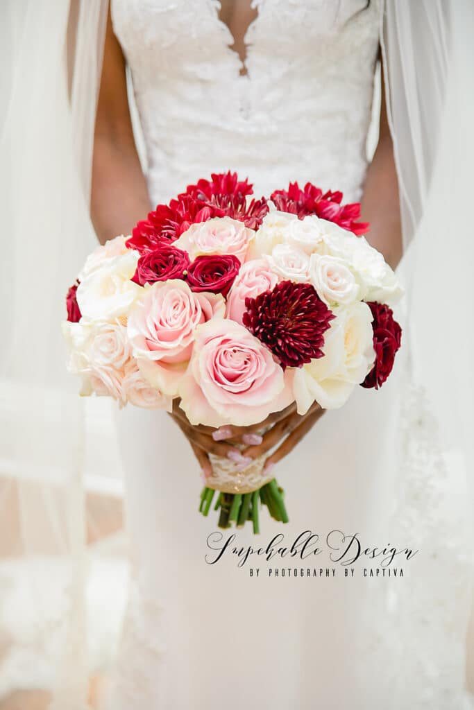 Bride with ombre bouquet of deep red to white