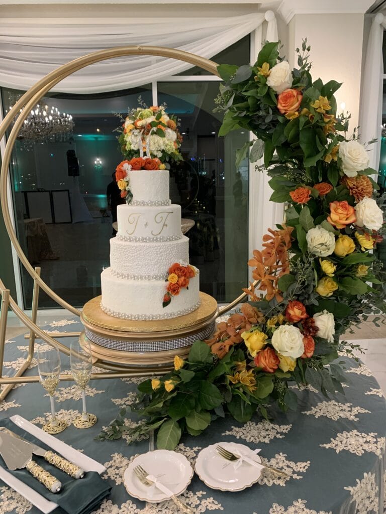 white wedding cake with fall flowers