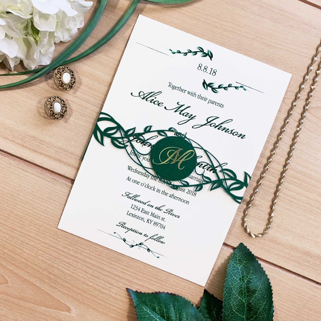 Green and white invitation with greenery band