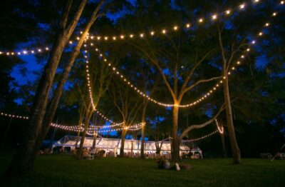 Far away shot of a wedding in a tent