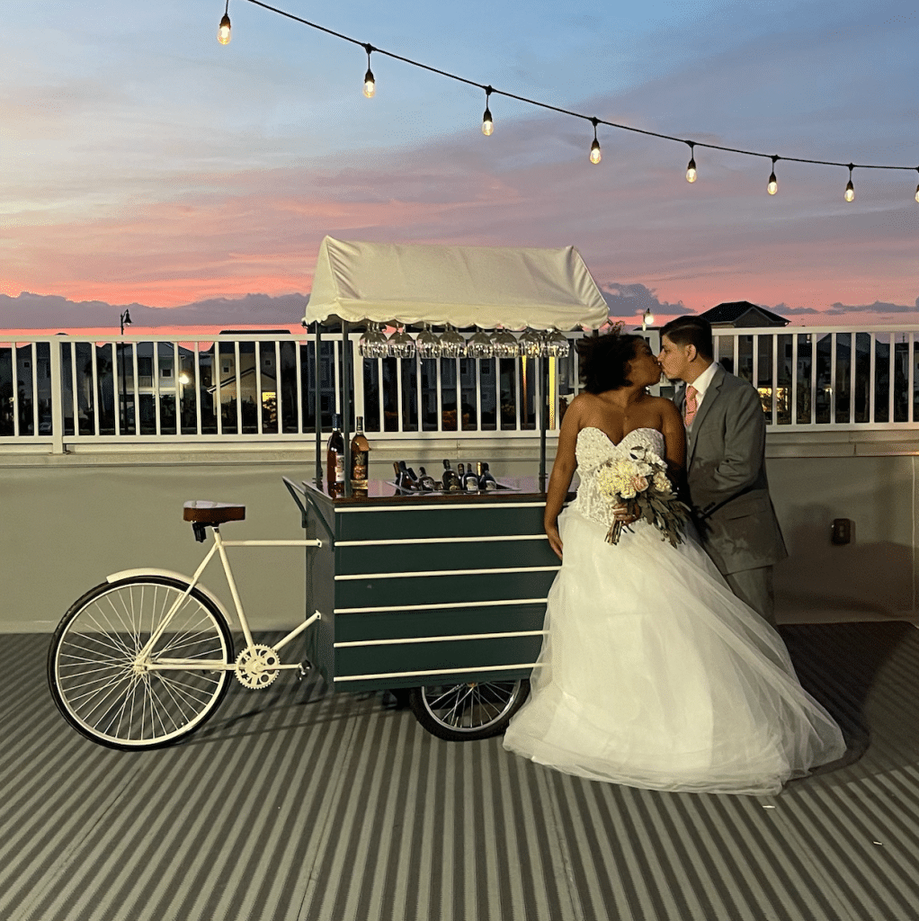 Bride and Groom by outdoor cycle bar