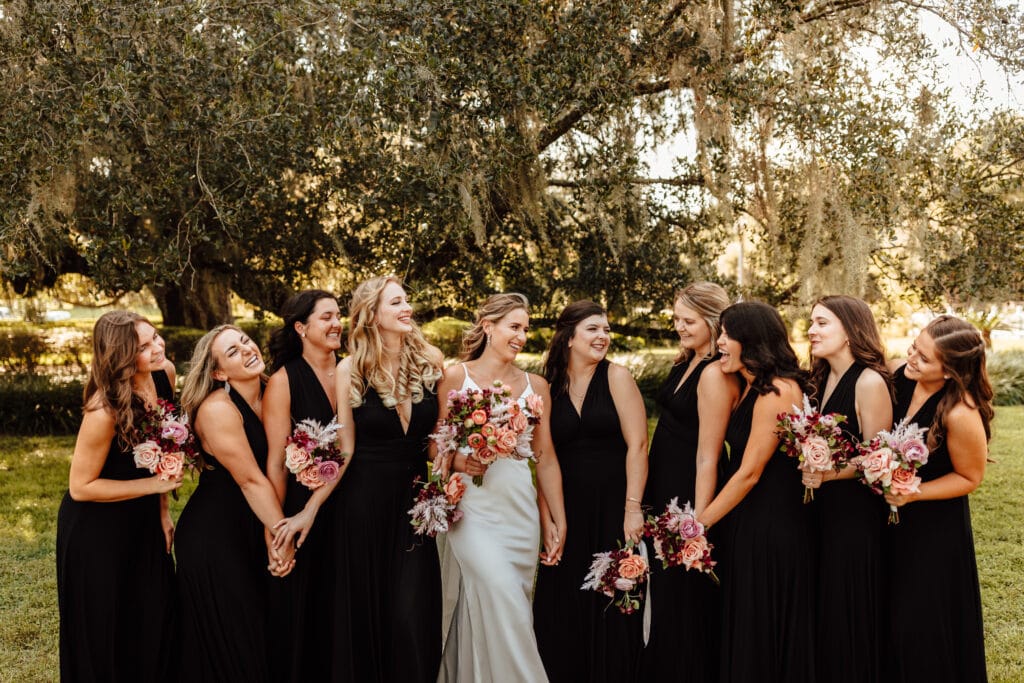 bride with bridesmaids in black