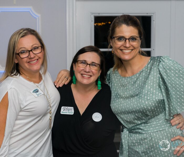 three orlando professionals at a networking event at Tuscawilla