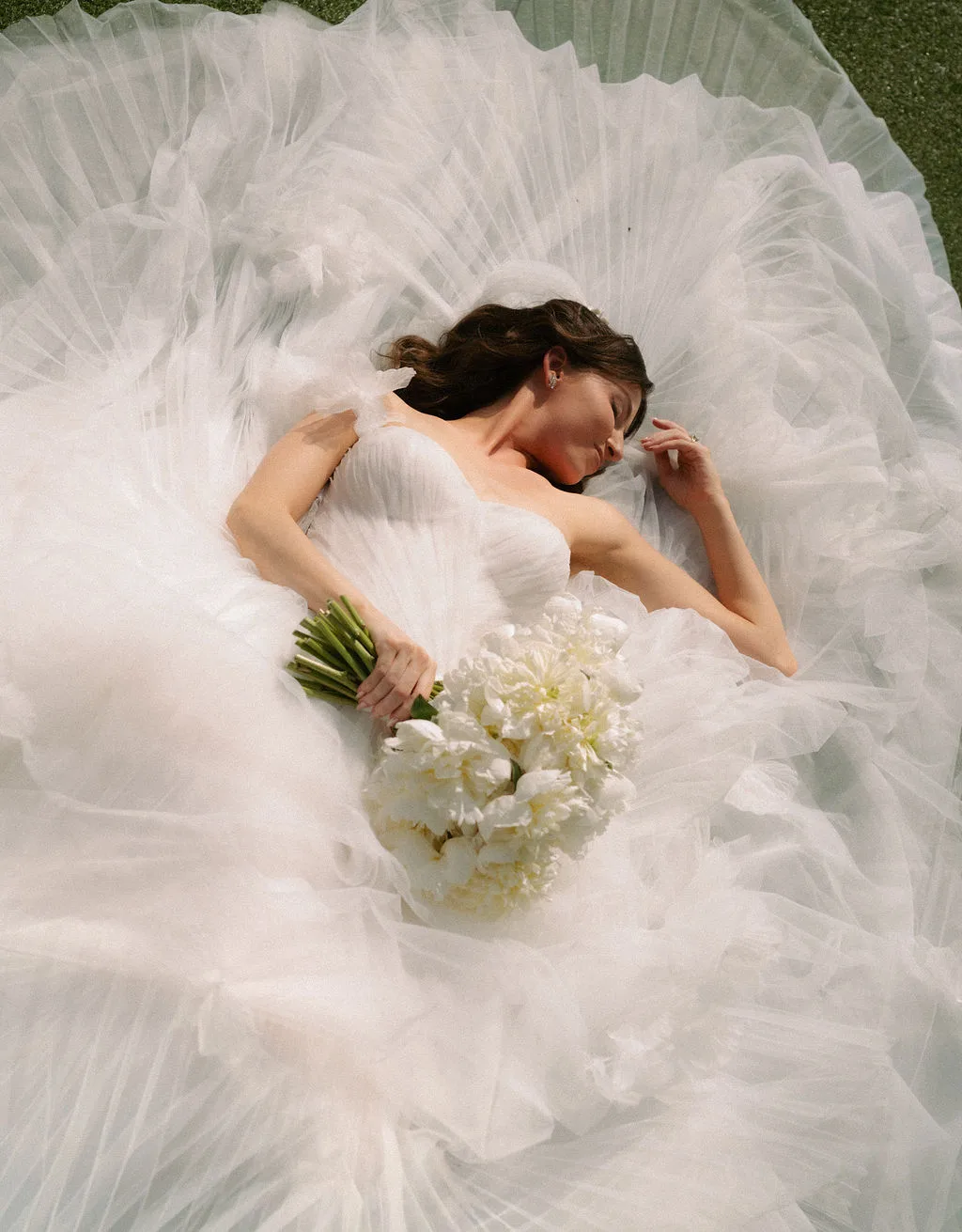 Brides capturing moments with her bridal bouquet as the perfect accesory.