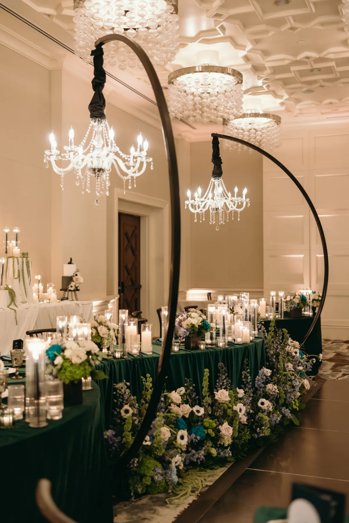 Blue, white, and green wedding reception flowers with candlelight at Four Seasons Resort Orlando.
