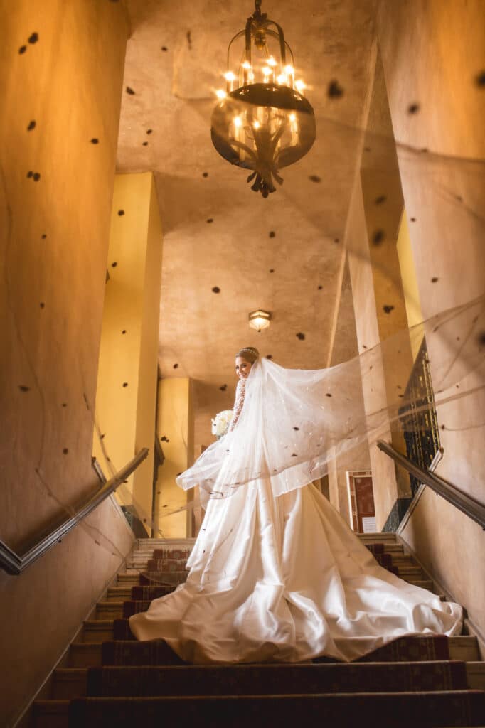 bride going up stone staircase