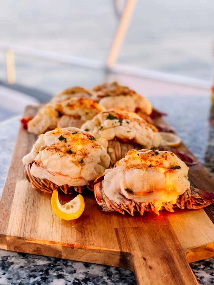 Lobster served on a wooden board by Millenia Events Catering