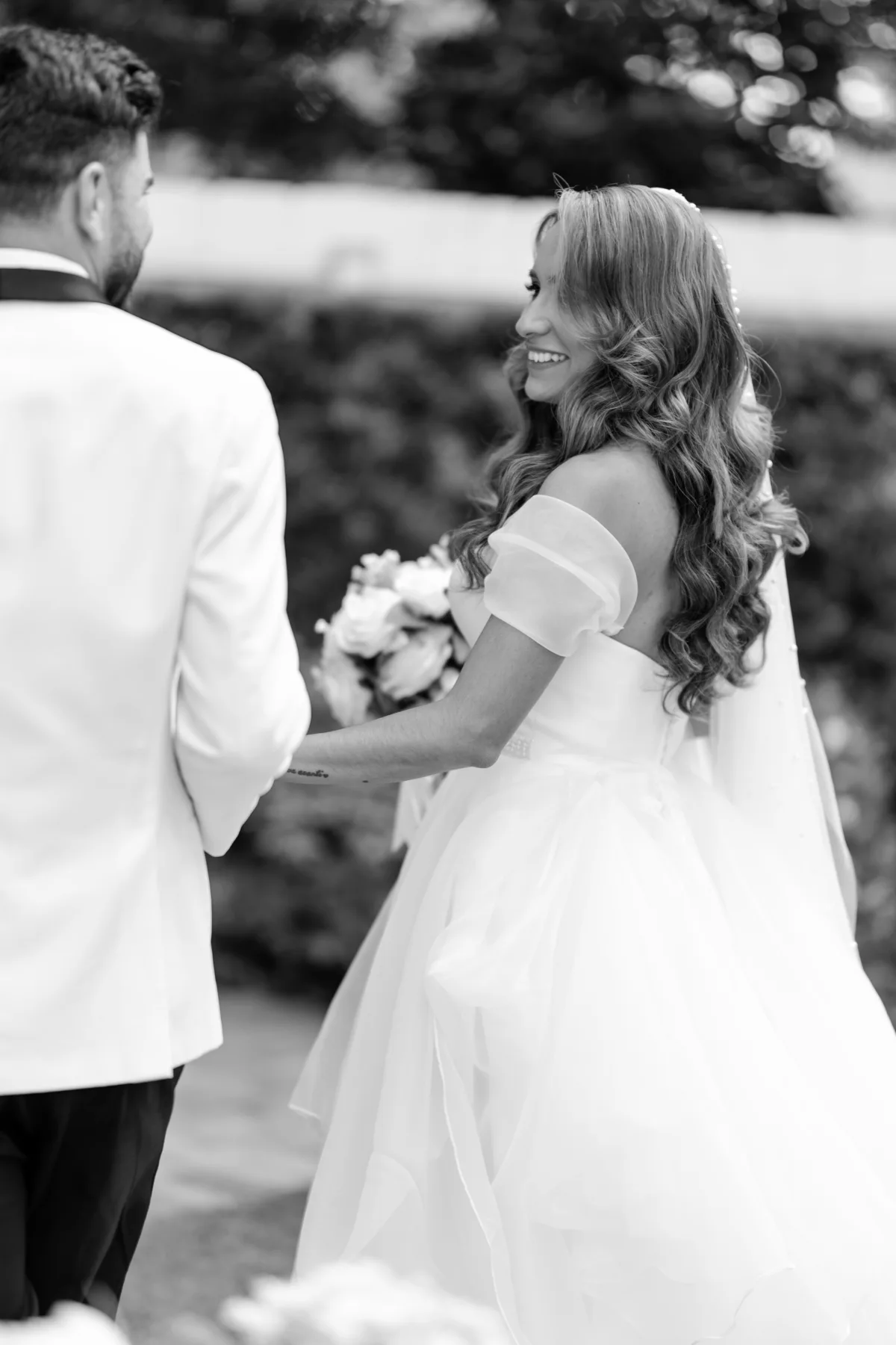 black and white documentary style bride and groom portrait