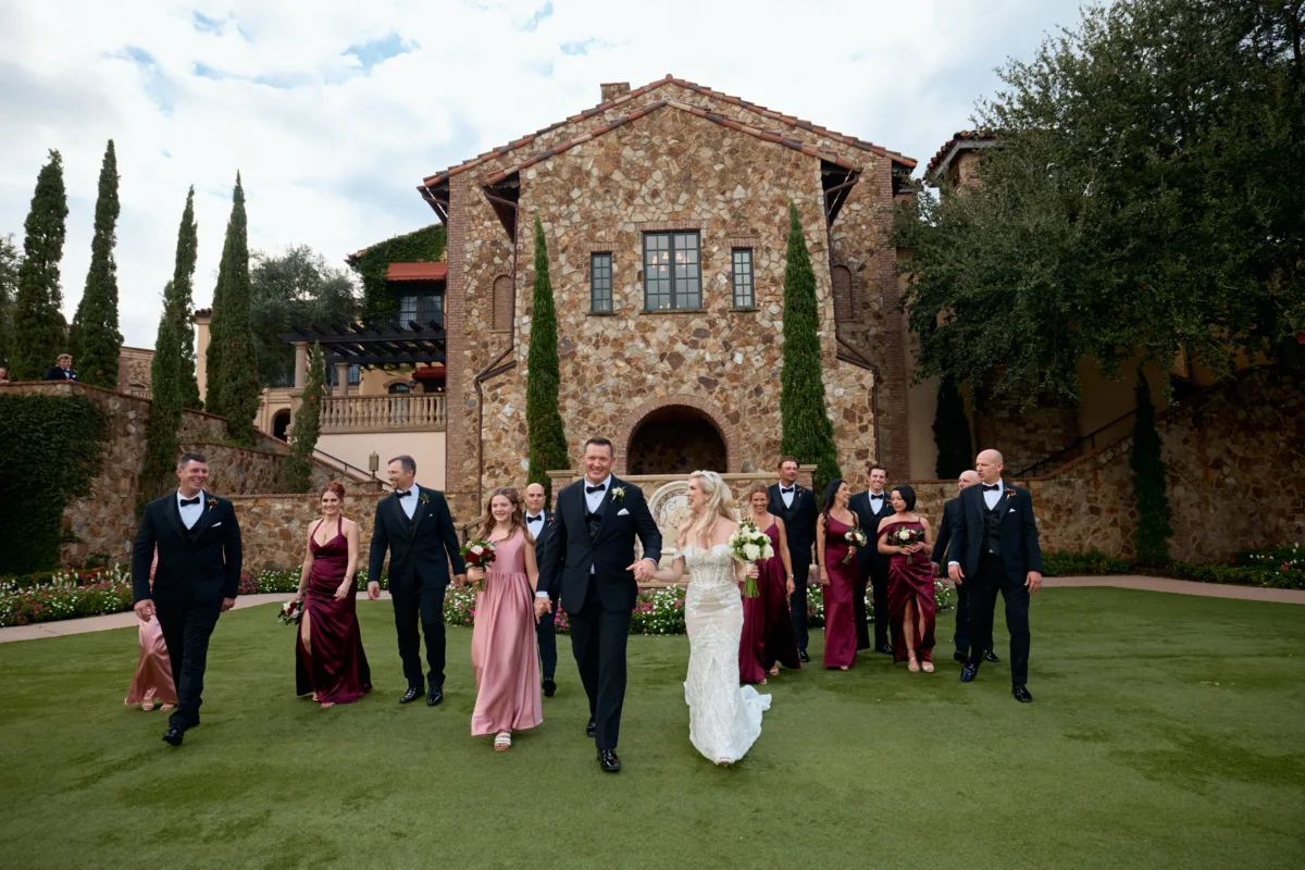Bridal party walking with the bella colina background