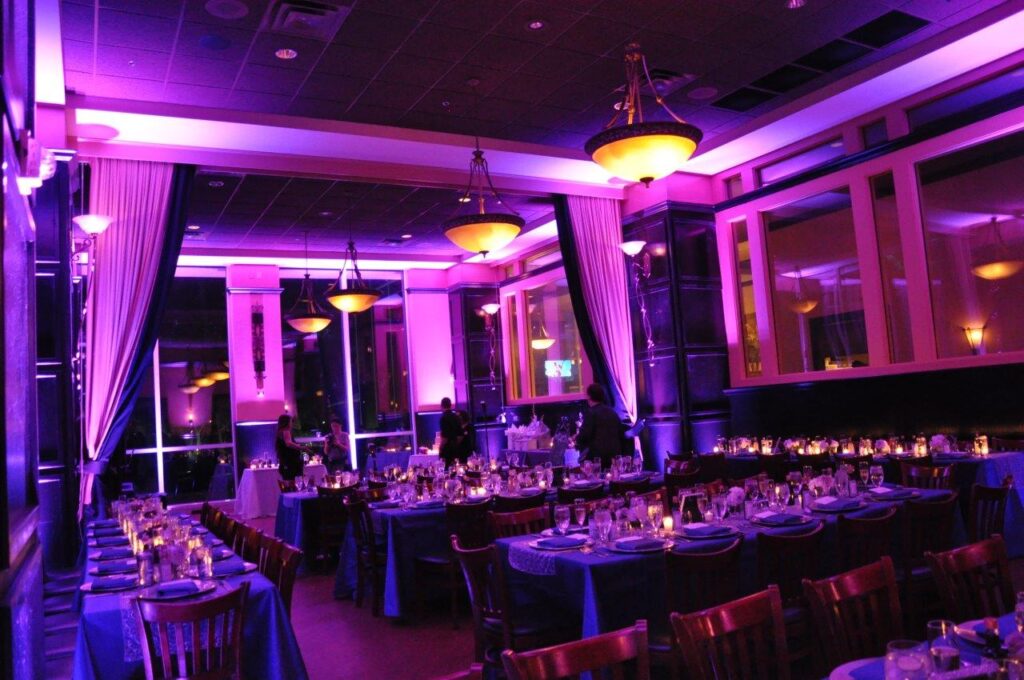 wedding reception with purple uplighting by Junction 88 Productions