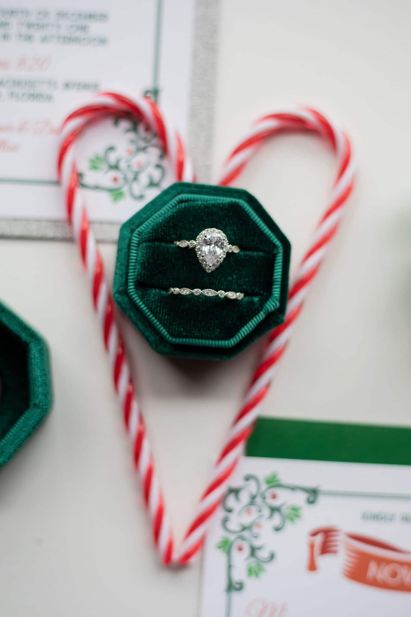 green velvet ring box with pear shaped diamond engagement ring