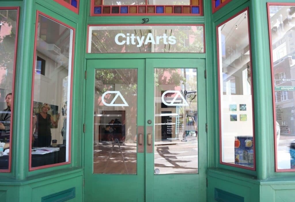 Green doors with sign at entrance to CityArts orlando