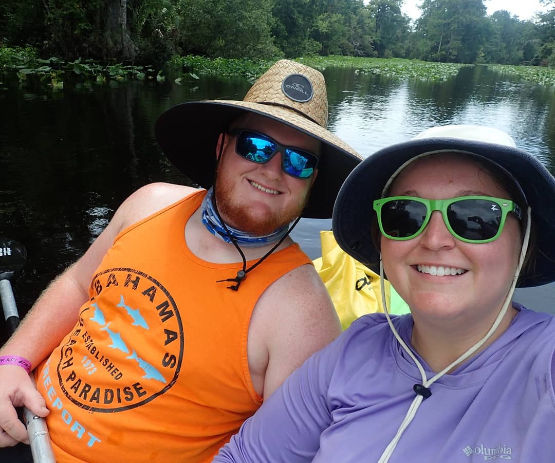 newly engaged couple kayaking