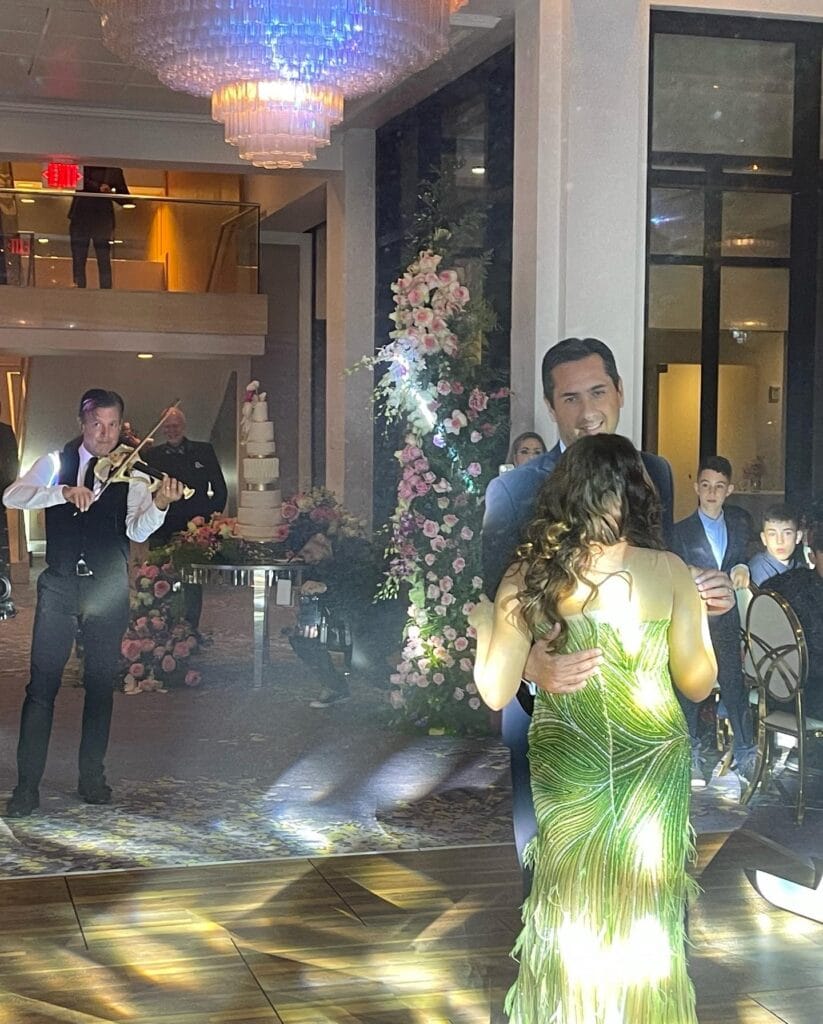 Gary Lovini violinist playing for couple dancing on a dance floor