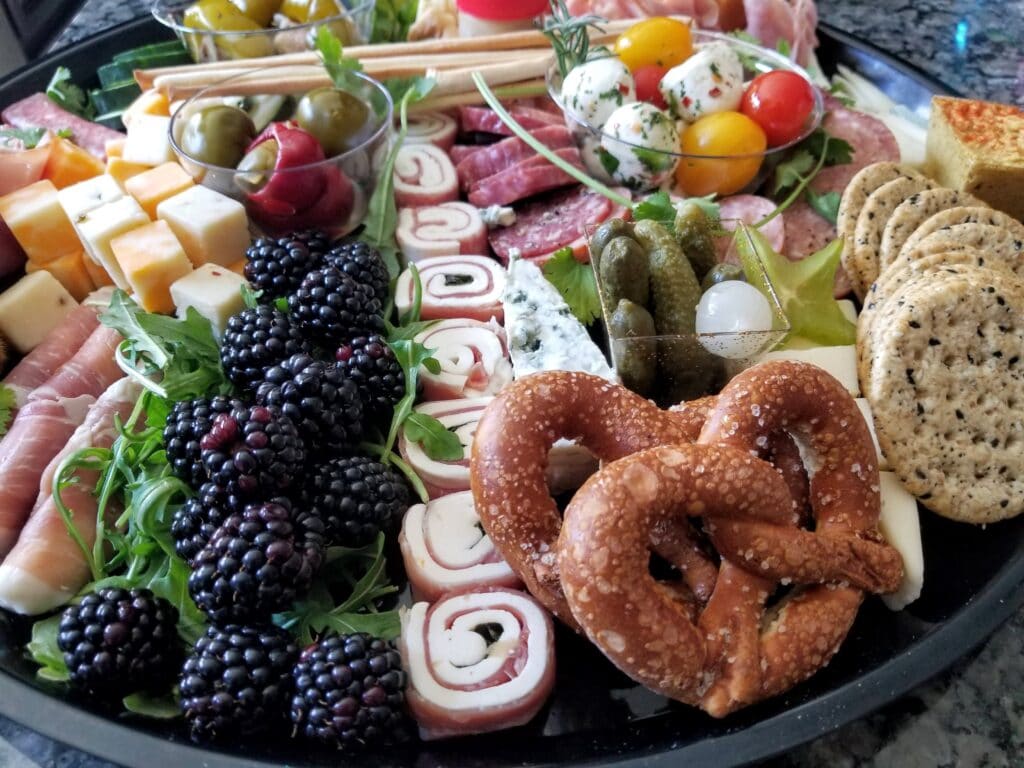 Pretzels, cheeses, cookies, and fruit charcuterie board