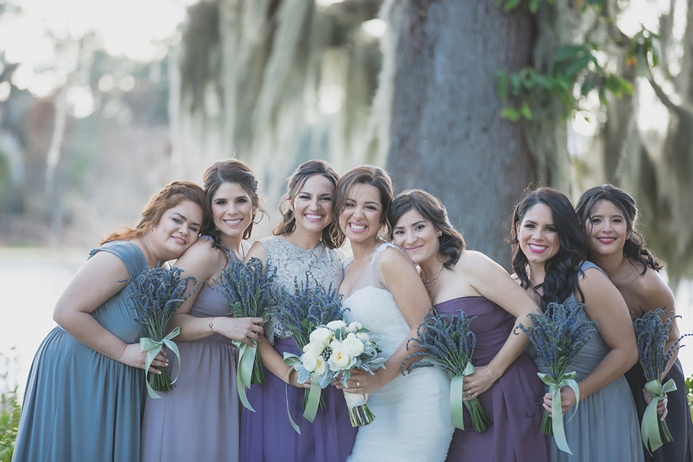 bridal party with flower bouquets