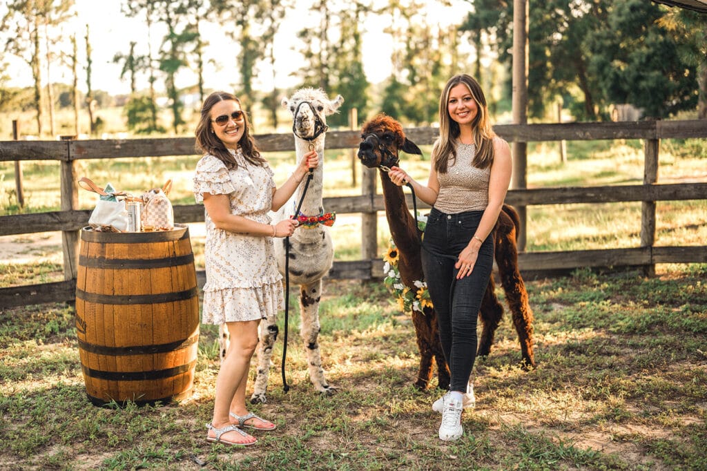 women with llama and alpaca Beautiful Creatures Farm To You Revue
