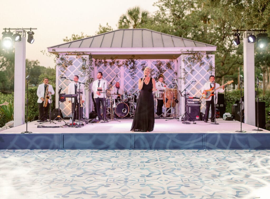 band performing by pool gazebo blonde ambition