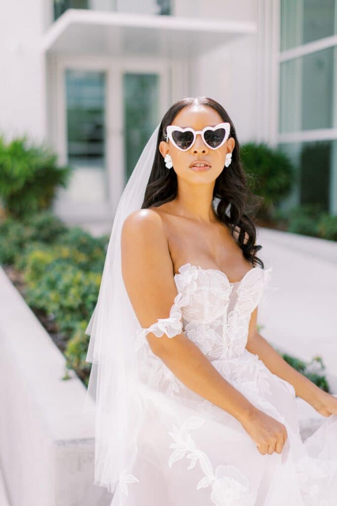 bride with fun sunglasses and hair and make-up by Gabriella Anthoney’s Design Artistry