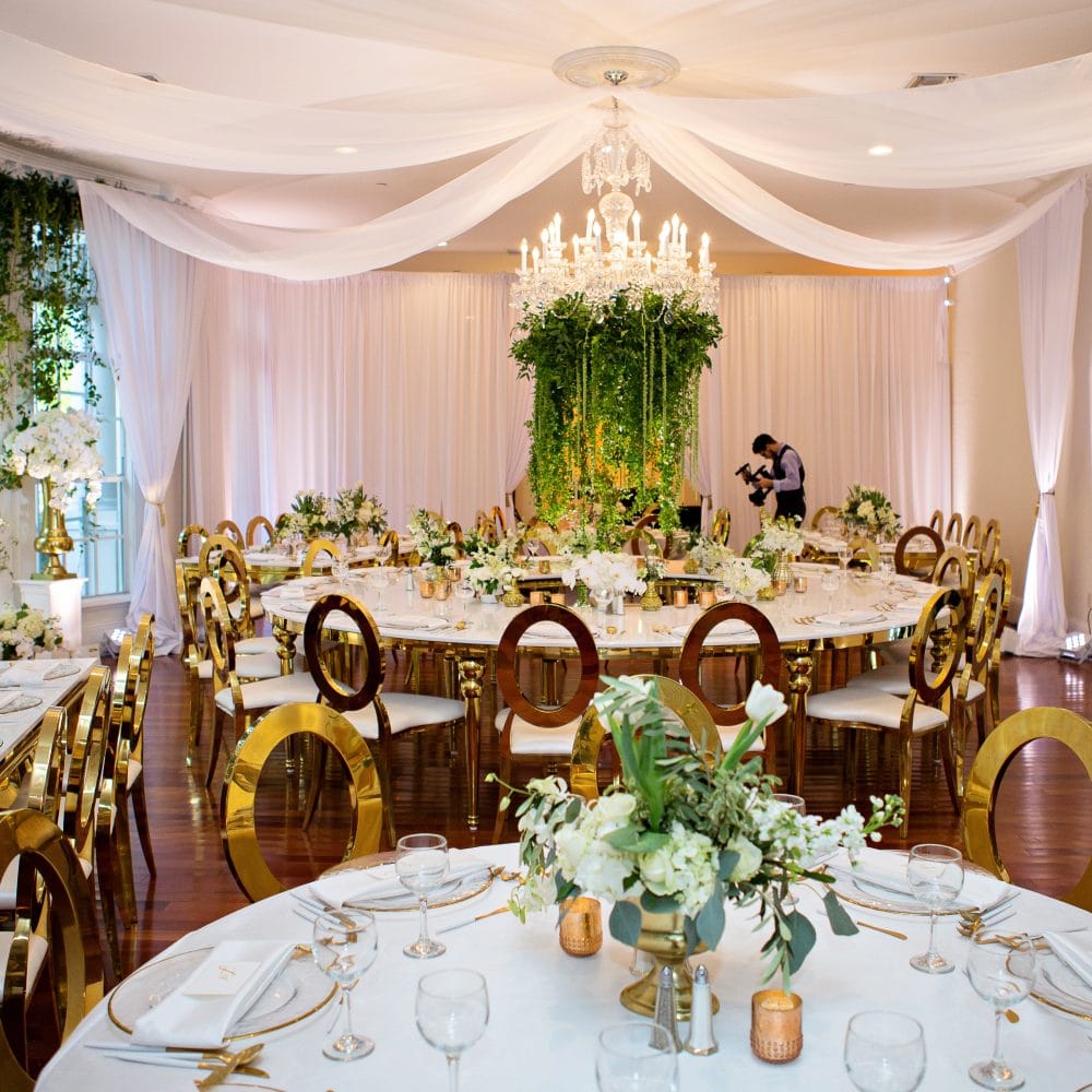 Flowers by Lesley wedding reception room with flowers and greenery in Orlando, FL