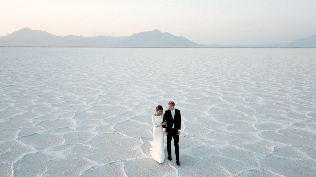 bride and groom on salt flats in wedding clothes by Lexi Rabelo Films