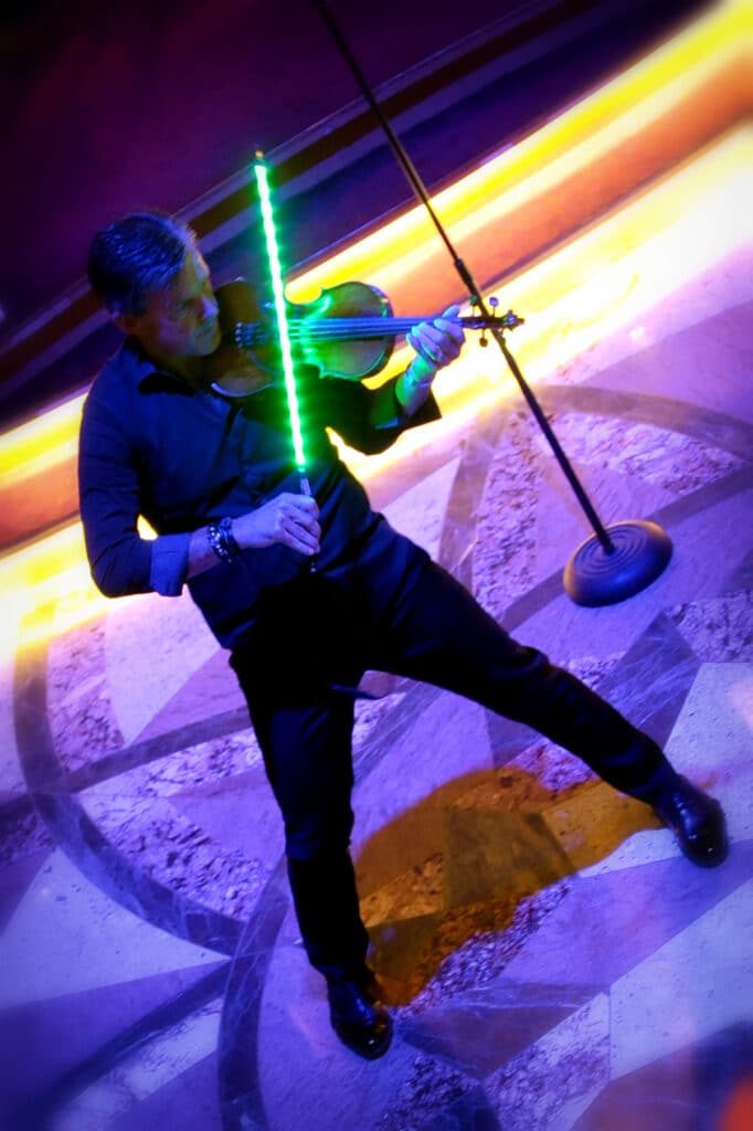 Gary Lovini violinist plays violin with light saber