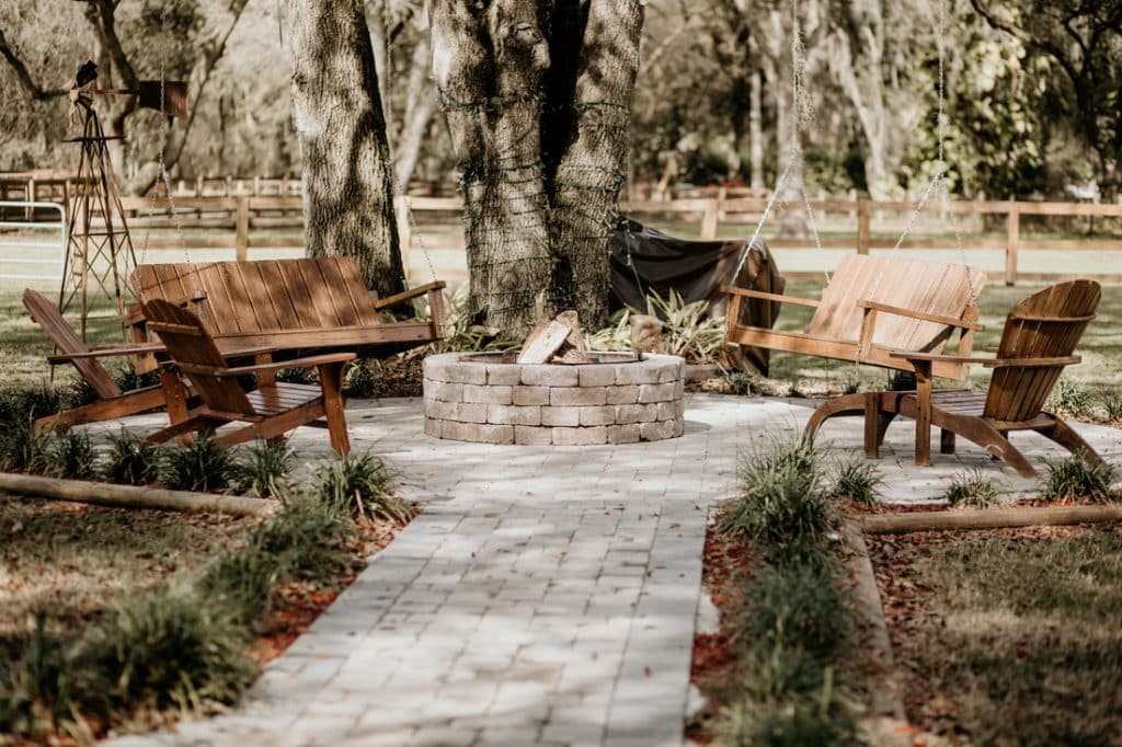 fire pit, stone walkway, wooden adirondack chairs, weeping willow tree, Still Creek Farm, Central FL