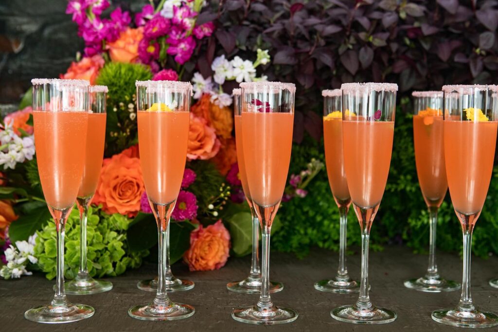 blood orange mimosas with sugared rim by Puff 'n Stuff Catering