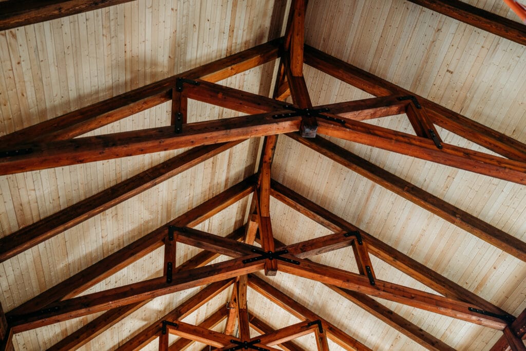 wooden rafters in the ceiling of a barn at The Sugar Barn at Flying Osceola Ranch