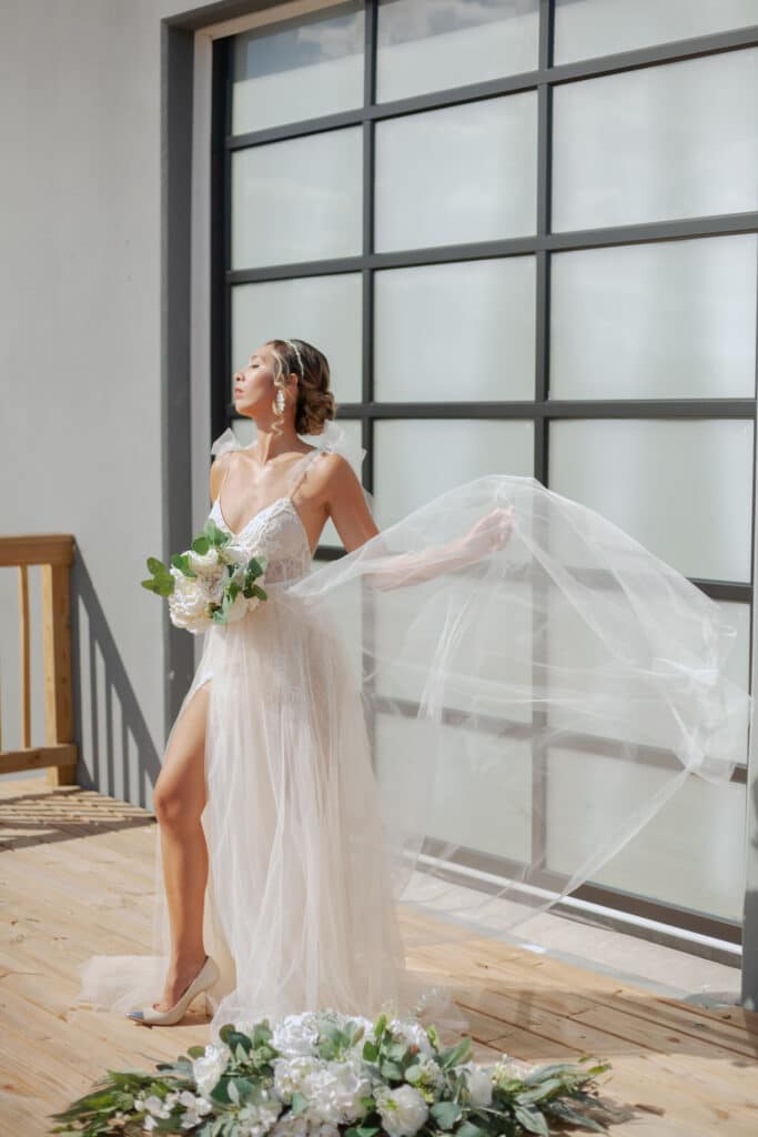 bride posing against an industrial roll-up door at D'Space Orlando