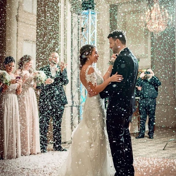 Bride and groom dancing under snow effect cloud by Imperial Pyro and Special Effects LLC