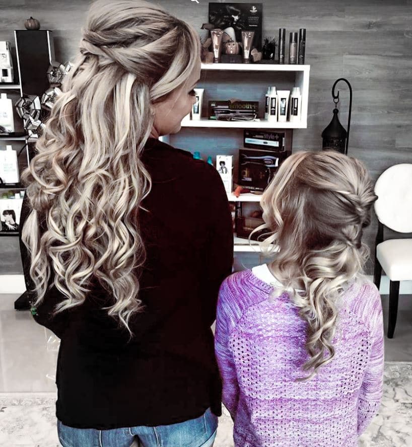 woman and little girl in beauty salon with long curly hair by Hair Logic Beauty Bar