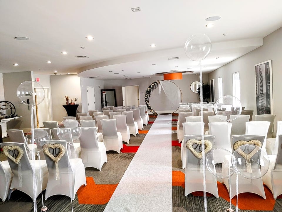 orange and white accents in wedding venue at Avanti International Resort