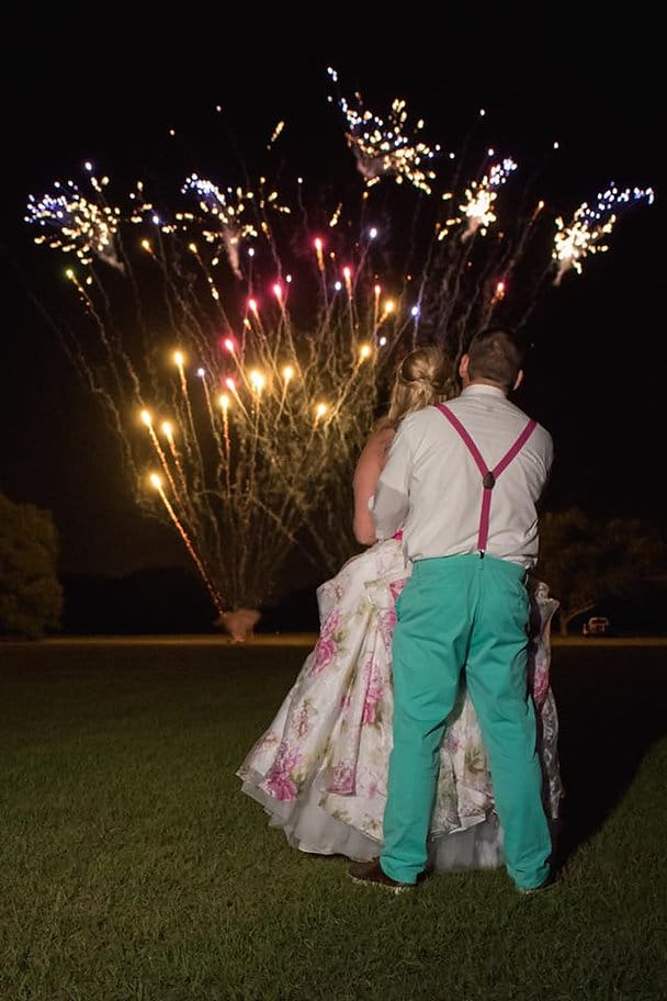 bride and groom watching fireworks by Imperial Pyro and Special Effects LLC at their wedding reception