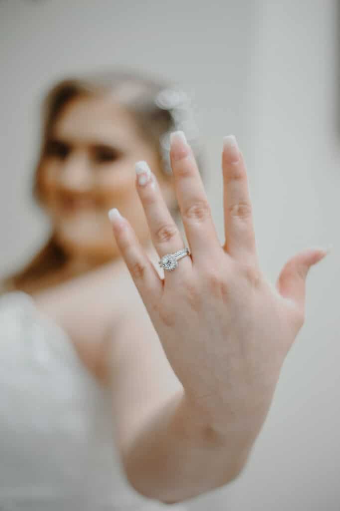 photo by Carolina Irais Photography of bride showing of her wedding ring