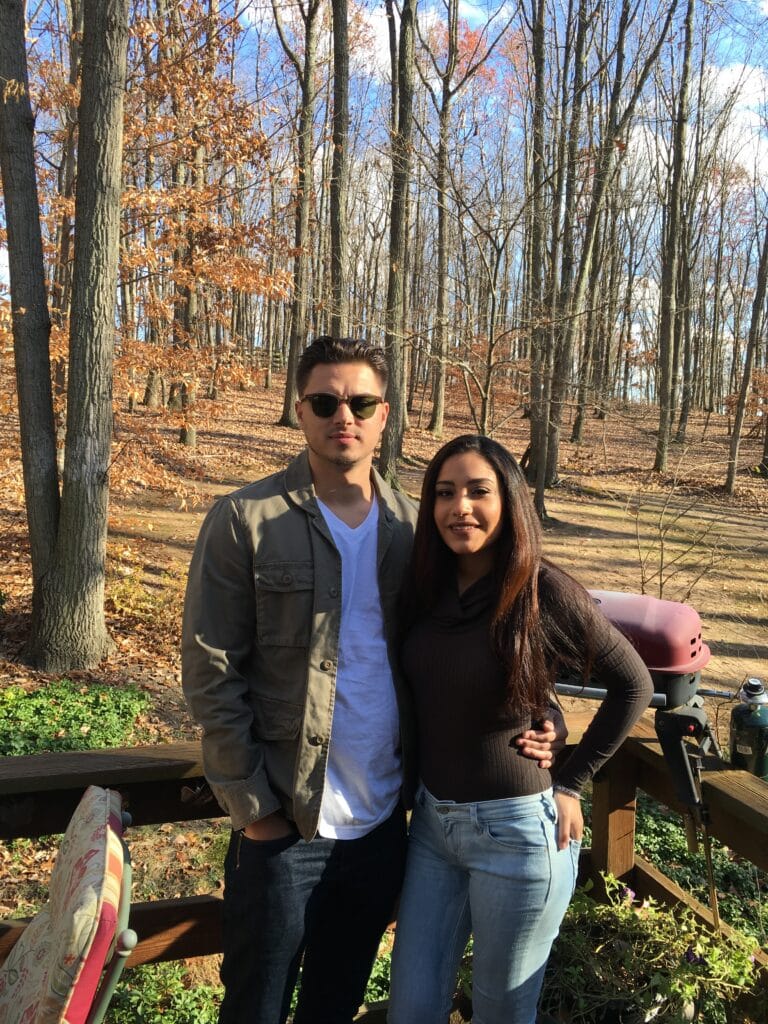 Couple posing in fall colors of mountains