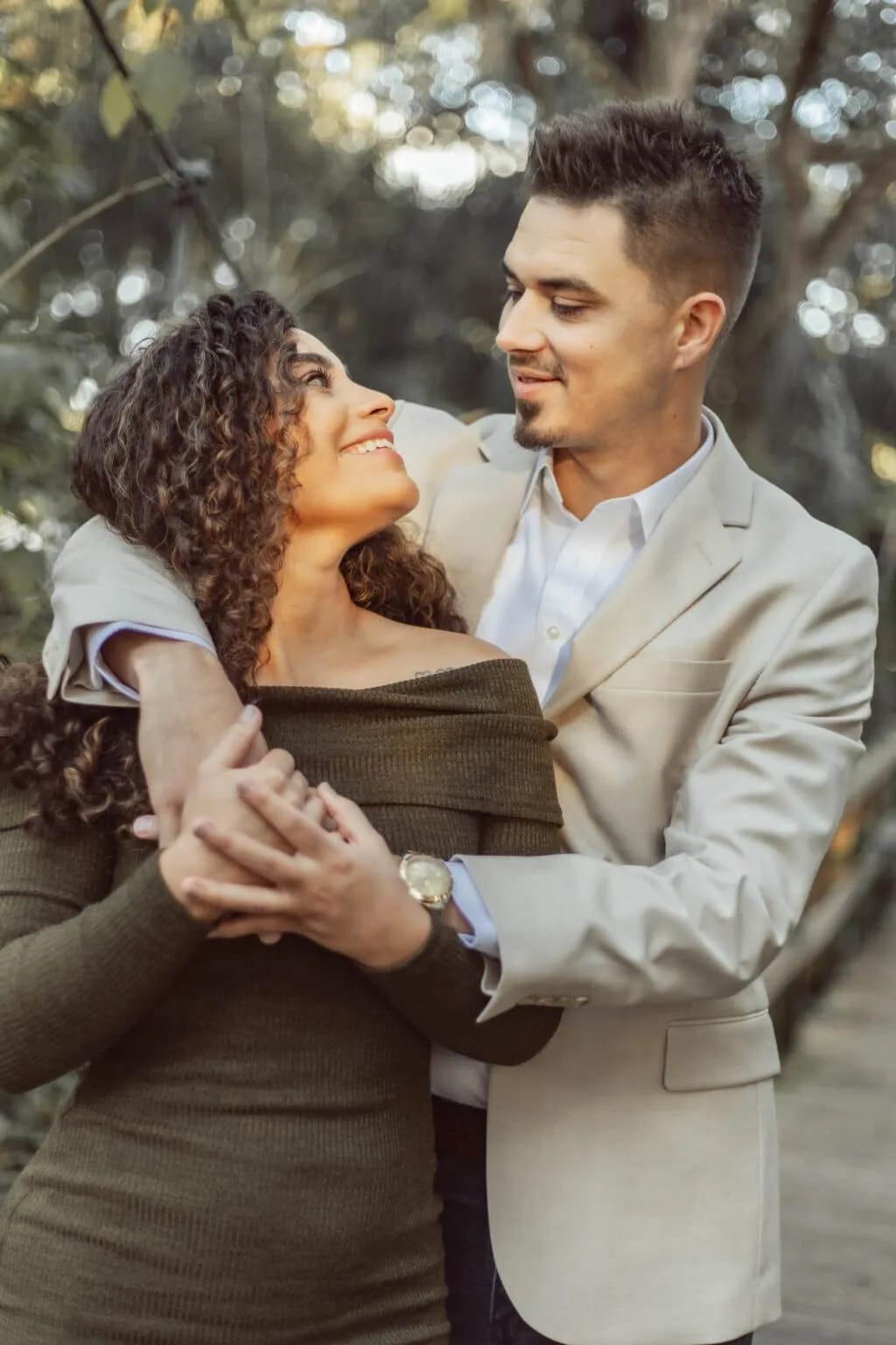 couple hugging and gazing into each others eyes