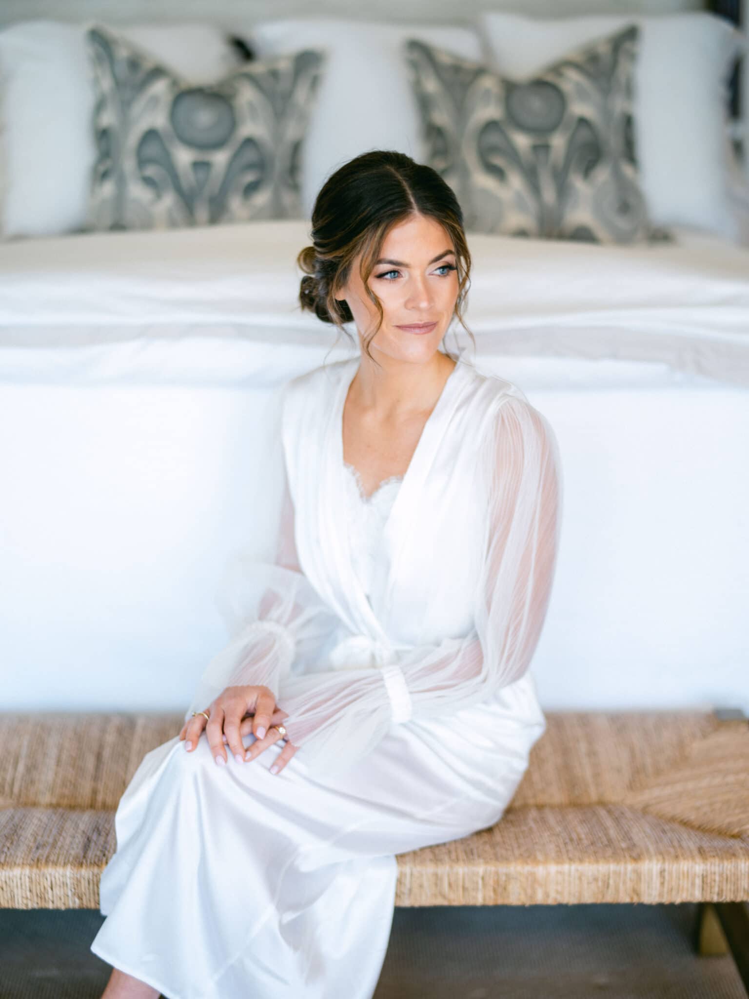 bride getting ready for wedding in robe and cami which are Items Brides need to Remember 
