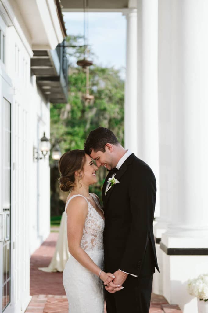 bride and groom kissing on outdoor patio photo by Rudy and Marta Photography