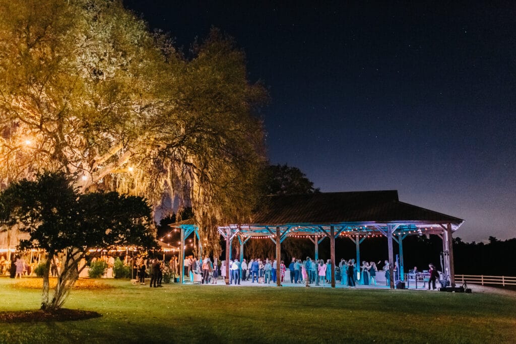 outdoor pavilion at Bramble Tree Estate lit up at night for wedding reception
